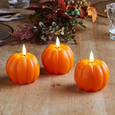 Imagen de Lights4fun Conjunto de 3 Velas Calabazas TruGlow® en Cera Naranja a Pilas y LED Blanco Cálido para Uso Interiores