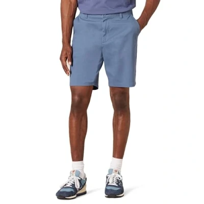 Imagen de Amazon Essentials Pantalones cortos chinos elásticos de 23 cm y corte entallado Hombre, Azul Oscuro, 29W