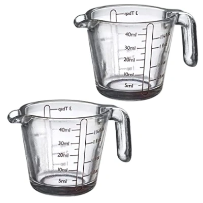 Imagen de Westmark 305522E3 Juego de 2 vasos medidores (40 ml, 4 escalas diferentes, aptas para horno, microondas, congelador, transparente/negro)
