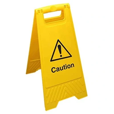 Imagen de Señal de suelo amarilla con texto en inglés &quot;VSafety Caution&quot;