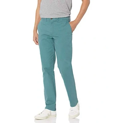 Imagen de Amazon Essentials Pantalones chinos de pitillo, elásticos, informales Hombre, Verde Oscuro, 31W / 28L