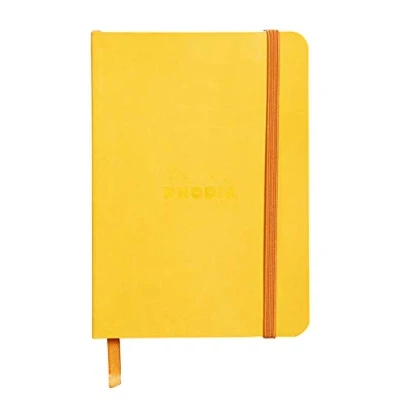 Imagen de RHODIA 117316C Carnet Souple Jonquille A6 Ligné 144 pages Papier Clairefontaine Ivoire 90 g/m² Marque Page, Fermeture Élastique Couverture Simili Cuir Collection Rhodiarama
