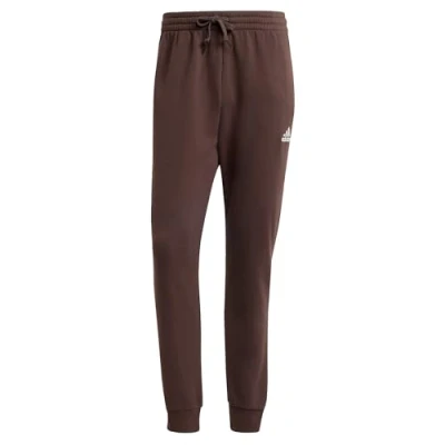 Imagen de adidas Essentials Fleece Regular Tapered Pants Pantalones, Shadow Brown, XXS Short Hombre