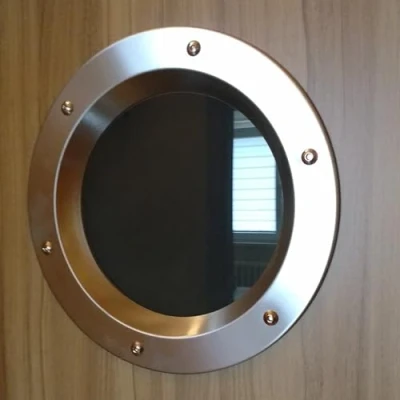 Imagen de Ojo de buey para puerta acero inoxidable INOX, diámetro 350 mm, vidrio transparente, tuercas collar.