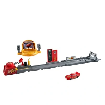 Imagen de Mattel Disney Pixar Cars Pista de acrobacias y saltos Copa Pistón Conjunto juego con vehículo Rayo McQueen, más 50,8cm largo, dos formas jugar, JDJ02