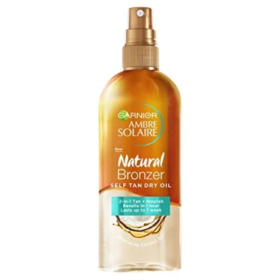 Imagen de Garnier Ambre Solaire aceite seco bronceador natural de 150 ml, 2 en 1 enriquecido con coco, nutre la piel y deja un bronceado falso luminoso, resultado sin rayas, dura