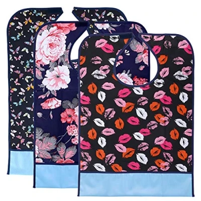 Imagen de BTSKY 3Pcs Baberos Reutilizables Impermeables para Adultos, Lavables, Protectores de Comida Ropa con Recogedor Migas Estampado Bonito
