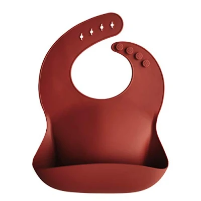 Imagen de mushie Babero de Silicona para Bebés Baberos Alimentación con Bolsillo 4 Tamaños Ajustables Accesorio Durable Niños Pequeños y Niñas Raw Sienna