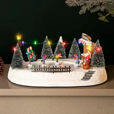 Imagen de Marco Paul Escena navideña tradicional de pueblo festivo, adorno decorativo con luces LED multicolor, funciona pilas, conexión USB, pista patinaje sobre hielo