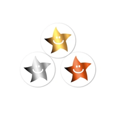 Imagen de Mini pegatinas de estrella sonriente recompensa en oro, plata y bronce. 540 x 10 mm por paquete. 180 unidades cada color.