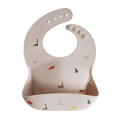 Imagen de mushie Babero de Silicona para Bebés Baberos Alimentación con Bolsillo Fáciles Lavar 4 Tamaños Ajustables Sin BPA Accesorio Durable Niños Pequeños y Niñas Dinosaurs