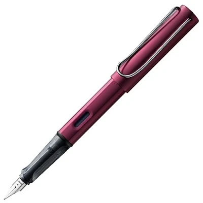 Imagen de Lamy AL star black purple Pluma estilográfica con empuñadura ergonómica y plumín de acero pulido en tamaño B cuerpo aluminio ligero incluye cartucho T 10 azul Diestro