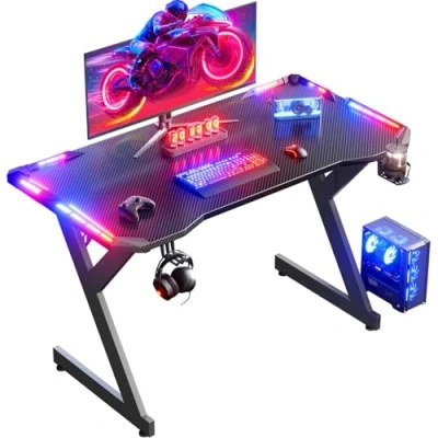 Imagen de HLFURNIEU 100 x 55 cm LED Mesa Gaming, Gamer de Superficie Fibra Carbono, Escritorio Gaming Ergonómica con Portavasos y Gancho para Auriculares, Negro