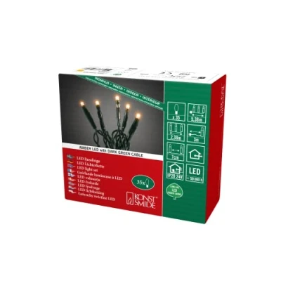 Imagen de Konstsmide Micro LED Lichterkette, verschweißt, bernsteinfarbene Dioden, 24V Innentrafo, dunkelgrünes Kabel Cadena de Luces, Coral, 35 LEDs