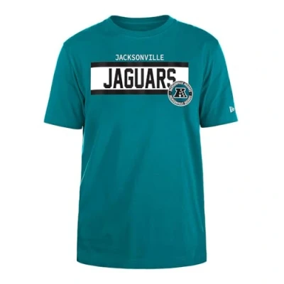 Imagen de Jacksonville Jaguars New Era Cap NFL Camiseta Regular de Tinta Alta Densidad Serigrafiada Frontal con gráfico Frontal, Color Original del Equipo, Unisex, Turquesa