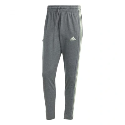 Imagen de adidas Hombre Essentials Single Jersey Tapered Open Hem 3 Stripes Pants, Dark Grey Heather, XS