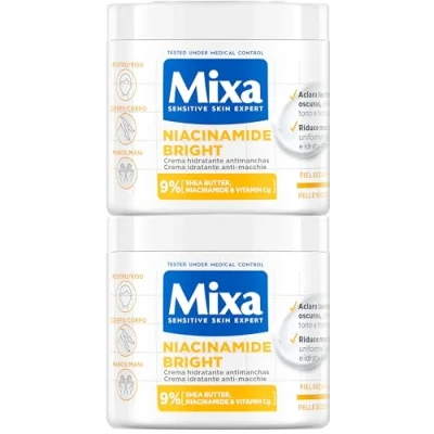 Imagen de Mixa Pack Ahorro Crema Corporal Niacidamide Bright para pieles apagadas con 9% de [Manteca karité + Niacinamida Vitamina Cg]. Aclara las manchas oscuras. Apta sensibles. 400 ml x2.