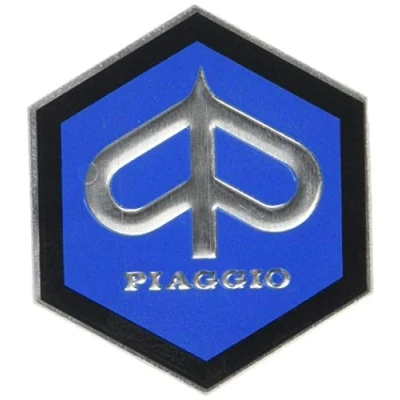 Imagen de Escudo «Piaggio» Hexagonal En Cascada De Aluminio, Autoadhesivo 49X43 Mm para Vespa Sprint/Rally, Etc.