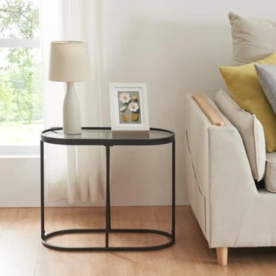 Imagen de [en.casa] Mesa Auxiliar Ovalada para Salón Tablero de Cristal Templado Dormitorio Pasillo Centro Mesilla Noche Estable Versátil Metal 55x28x45 cm Negro y Transparente