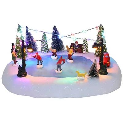 Imagen de Christmas Concepts® Escena animada de pueblo pista hielo con LED musical 30 cm, funciona pilas, reproduce 8 melodías navideñas