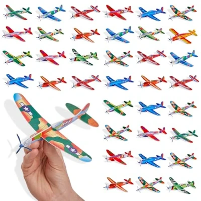 Imagen de THE TWIDDLERS 48 Aviones Planeadores para Niños Deslizadores Voladores en 12 Diseños Diferentes Fácil de Montar