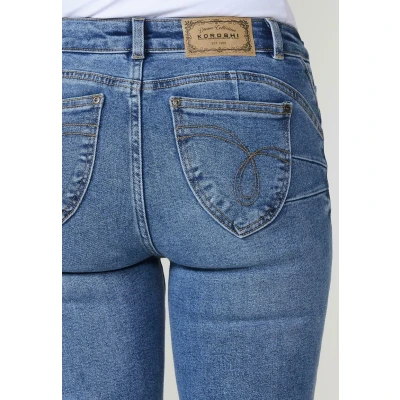 Imagen de Pantalón jeans azul oscuro mujer regular push up con bajos deshilachados